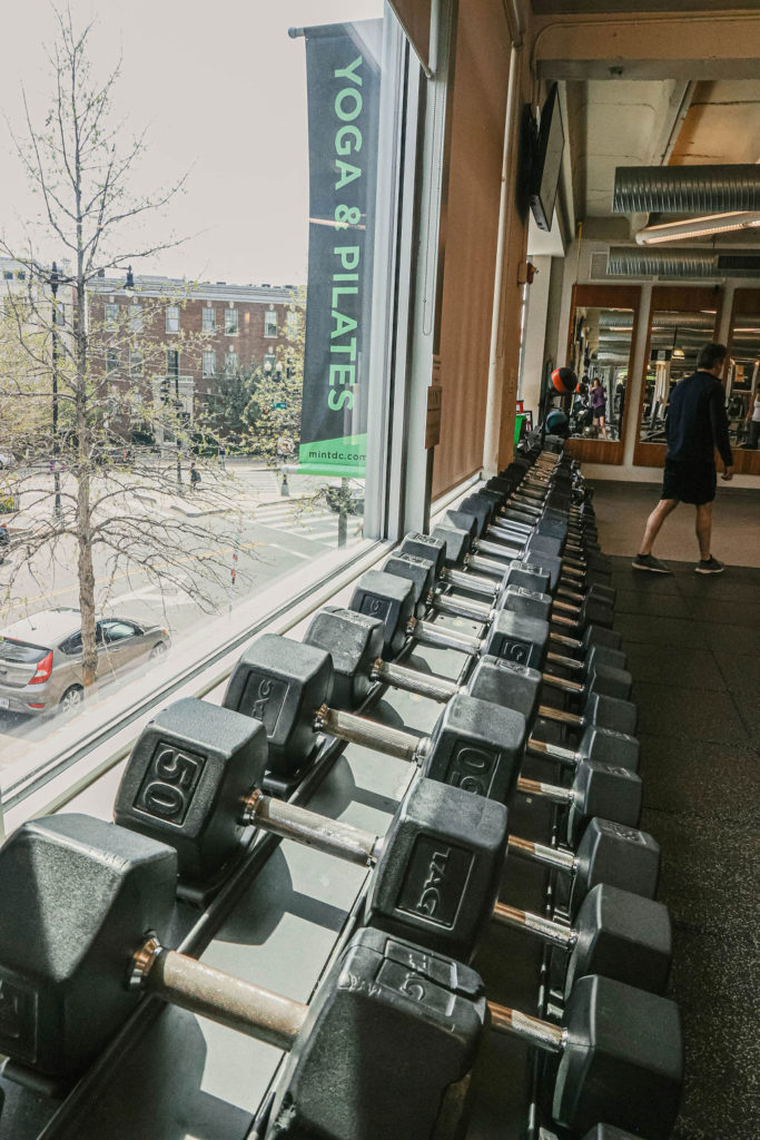 Free weights inside MINT's club against the window