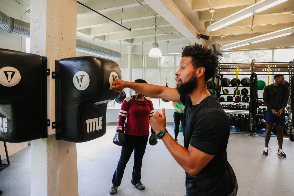 Personal Trainer James Parker-Ashley Leading a Boxing Class